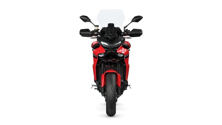 Front view of a red motorcycle with a black windshield, handlebars, and a prominent tire, set against a white background.