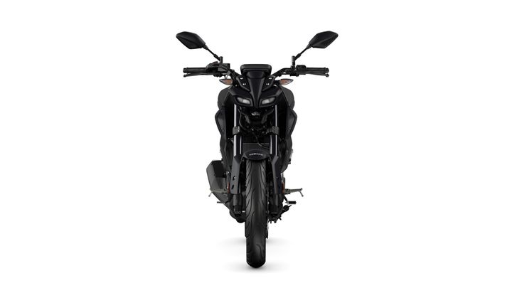 A front view of a sleek, black motorcycle showcasing its modern design, including prominent headlights, handlebars, and a wide tire.