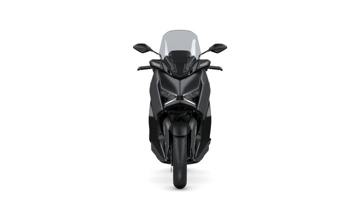 A sleek black scooter viewed from the front, featuring a large windscreen, angular headlights, and a smooth front tire.