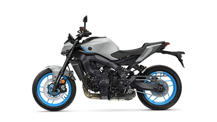 A sleek, modern motorcycle with a gray body and blue accents, showcasing a sporty design and performance features, viewed from the side.