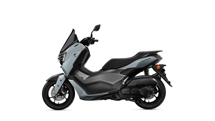 A light blue Yamaha NMAX scooter displayed in profile, featuring a sleek design, a windshield, and modern dual-tone color scheme with matte and glossy finishes.