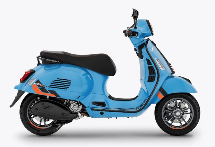 A blue motor scooter with black seat and trim, displayed in profile view against a white background.