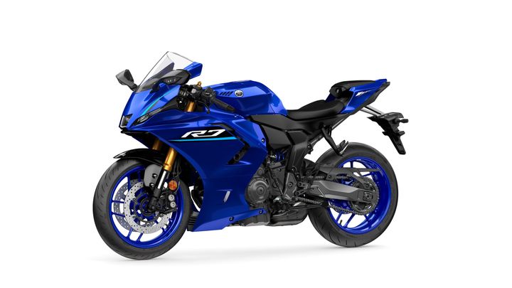A blue Yamaha R7 motorcycle displayed at a slight angle, showcasing its sleek design, sporty features, and distinctive styling.