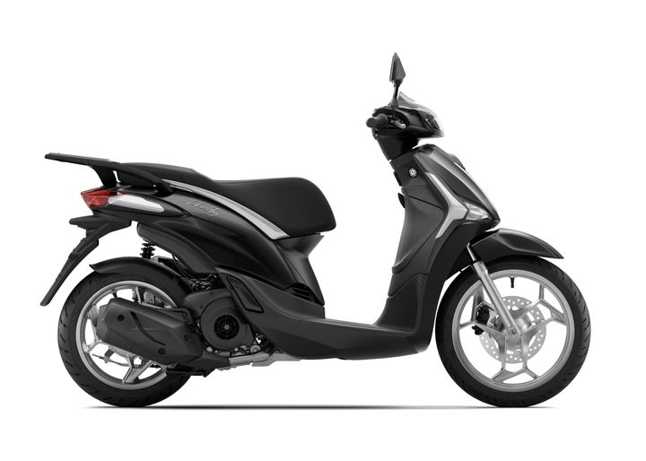 A sleek black scooter viewed from the side, showcasing its modern design, prominent rear wheel, streamlined body, and comfortable seat.