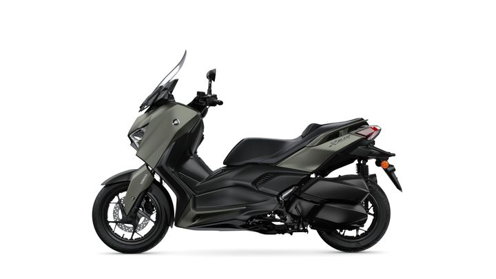 A sleek, modern gray scooter with a streamlined design, featuring a large windshield, comfortable seat, and distinct Yamaha branding, positioned at a slight angle against a white background.