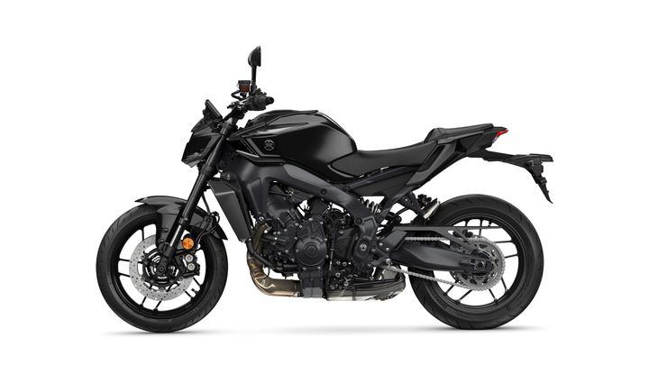 A sleek, black motorcycle viewed from the side, showcasing its sporty design and features including a prominent engine, disc brakes, and a modern frame.
