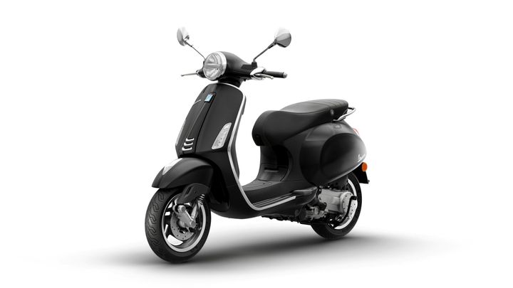 A sleek black scooter with a classic design, featuring a round headlight, mirrors, and a comfortable seat, positioned on a white background.
