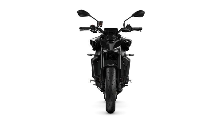 A sleek black motorcycle viewed from the front, showcasing its sharp design, handlebars, and wide tire against a white background.