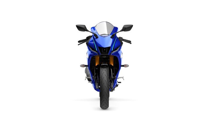 Front view of a blue sport motorcycle featuring a sleek design, racing fairings, and dual headlights.