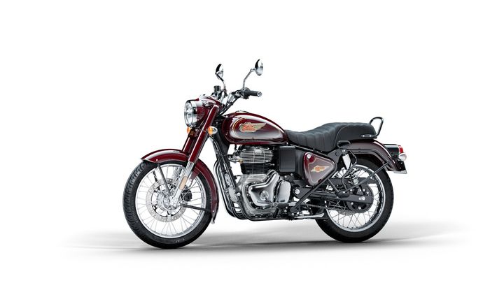 A red and burgundy classic motorcycle with chrome detailing, positioned against a white background.