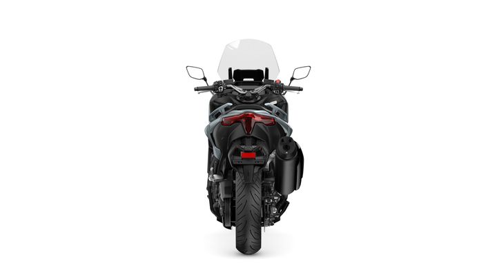 A rear view of a black motorcycle with a clear windscreen, LED taillight, and dual exhaust. The motorcycle features a thick rear tire and is set against a white background.