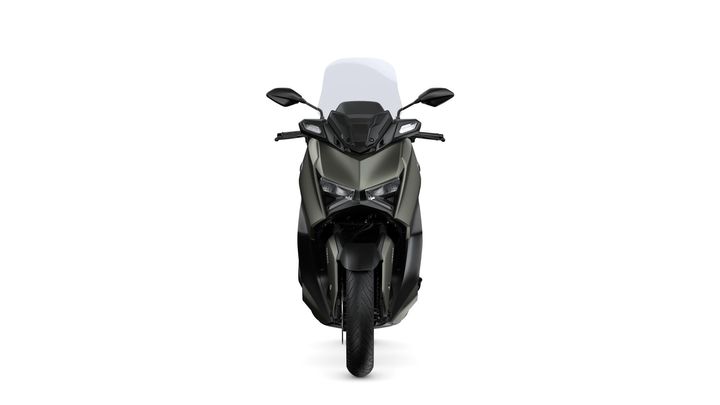 Front view of a sleek, modern scooter in an olive green and black color scheme, featuring a large windscreen and LED headlights.