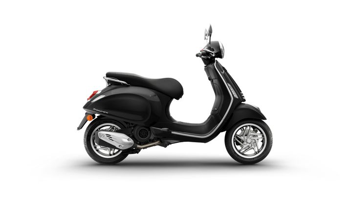 A sleek black scooter viewed from the side, featuring a rounded body, chrome accents, and a comfortable seat.