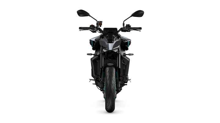 Front view of a modern motorcycle with a sleek design, featuring a dark body, dual mirrors, and a prominent wheel at the bottom. The background is plain white, emphasizing the motorcycle's details.