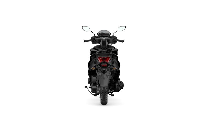 A black scooter viewed from the rear, featuring a sleek design, visible tail lights, and rear tire.
