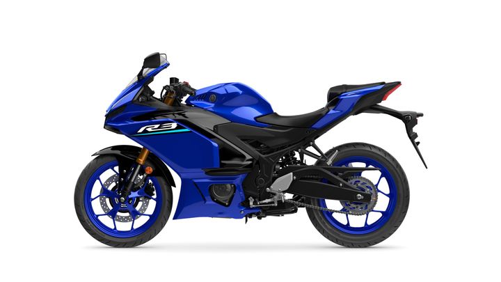 A blue sports motorcycle, Yamaha YZF-R3, shown in profile with a sleek design, sporty fairings, and distinctive blue wheels.