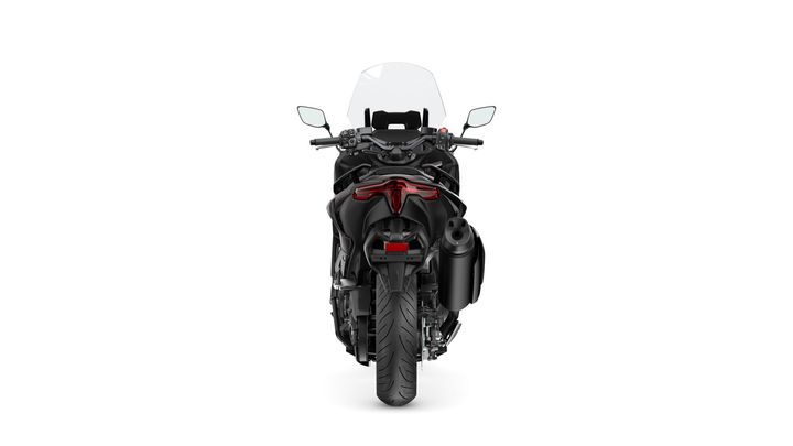 A rear view of a black motorcycle featuring a tinted windshield, defined tail lights, and a prominent exhaust pipe. The motorcycle sits on a white background.