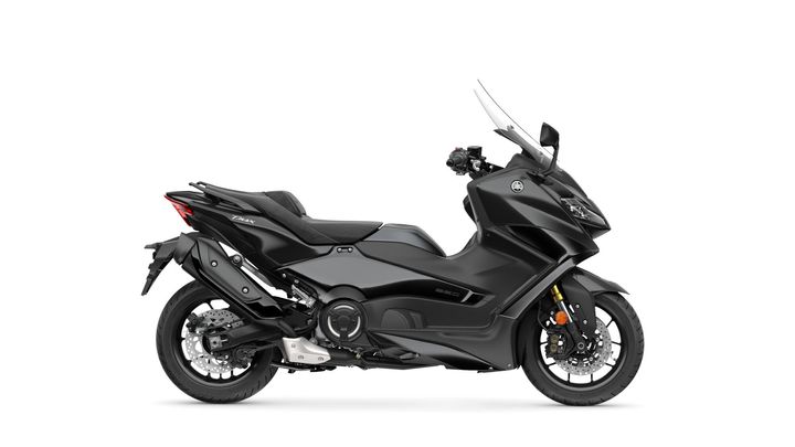 A sleek black Yamaha Tmax scooter, featuring modern design elements, a large windshield, and dual exhausts, positioned against a white background.