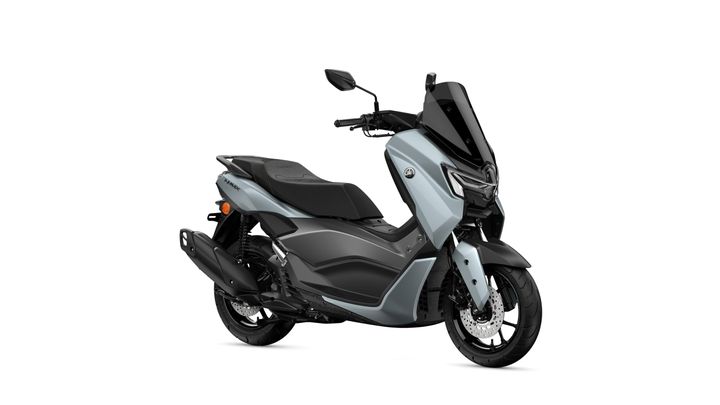 Yamaha 2026 NMAX 125 Tech MAX A sleek, modern scooter with a predominantly silver body, accented by black components and a streamlined design, positioned at an angle to showcase its features.