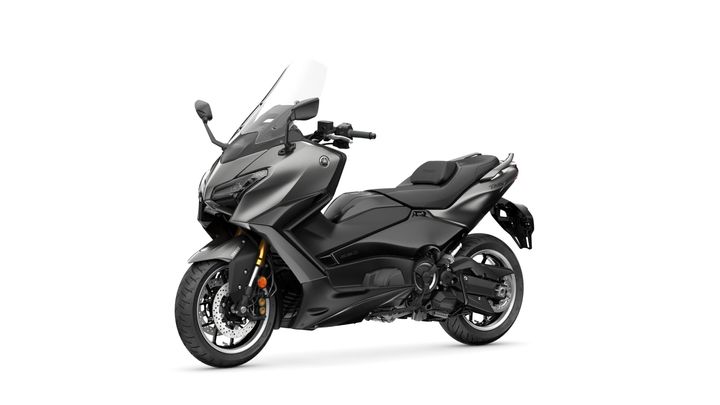 A sleek, modern black scooter with a prominent windshield, sporting a low-profile design and gold accents on the front suspension. The motorcycle is positioned at an angle, showcasing its curved body and distinctive rear details against a white background.