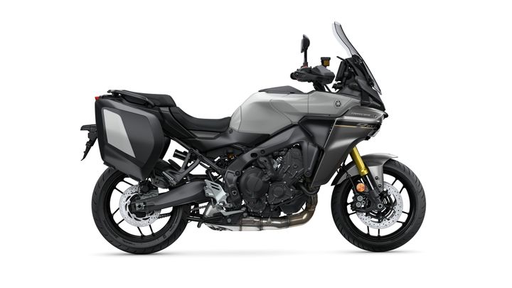 A sleek gray Yamaha motorcycle, featuring a sporty design, adjustable windshield, and side panniers for storage. The bike showcases a powerful engine and modern styling, positioned against a white background.