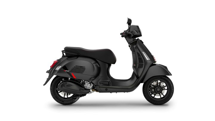 A sleek black scooter with sporty design elements, shown in profile, featuring a comfortable seat, modern handlebars, and distinctive wheel rims.
