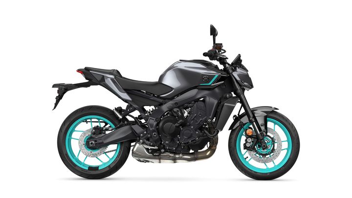 A sleek black motorcycle with turquoise wheels and accents is displayed in profile against a white background.