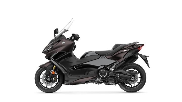 A sleek, modern Yamaha TMAX scooter in a deep metallic brown color, featuring a sporty design, large windshield, and two-tone seat, positioned against a white background.